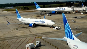 FILE - A United Airlines plane is pushed from the gate at George Bush Intercontinental Airport Friday, Aug. 11, 2023, in Houston. (AP Photo/David J. Phillip) 