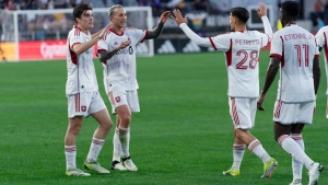 Toronto FC forward Federico Bernardeschi, (10) celebrates with his teammates after his goal against D.C. United during the first half of an MLS soccer match Saturday, June 1, 2024, in Washington. (AP Photo/Jose Luis Magana) 