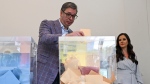 In this photo provided by the Serbian Presidential Press Service, Serbian President Aleksandar Vucic casts his ballot for a local election at a polling station in Belgrade, Serbia, Sunday, June 2, 2024. (Serbian Presidential Press Service via AP)