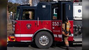 Eight people, including four children, were hospitalized with second and third degree burns after a fire and possible explosion at a home south of Montreal. A firefighter gets into their truck in Pointe Claire, a borough of Montreal, Thursday, March 7, 2024. THE CANADIAN PRESS/Christinne Muschi