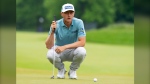 Mackenzie Hughes, of Dundas, Ont., lines up his putt on the 2nd hole in the final round of the Canadian Open in Hamilton, Ont., Sunday, June 2, 2024. THE CANADIAN PRESS/Frank Gunn