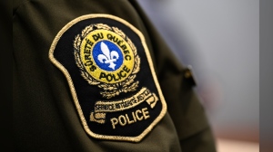 A 31-year-old man has been arrested in connection with the death of a young child in a boating incident in Quebec's Laurentians. A Sûreté du Québec, or Quebec provincial police, patch is seen on an officer's uniform at a news conference, in Quebec City, Thursday, Feb. 29, 2024. THE CANADIAN PRESS/Jacques Boissinot