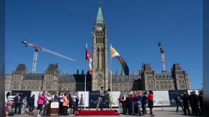 Prime Minister Justin Trudeau and Women and Gender Equality and Youth Minister Marci Ien raise the pride flag during an event on Parliament Hill, in Ottawa, Monday, June 3, 2024. THE CANADIAN PRESS/Adrian Wyld