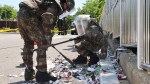 South Korean soldiers wearing protective gears check the trash from a balloon presumably sent by North Korea, in Incheon, South Korea, Sunday, June 2, 2024. (Im Sun-suk/Yonhap via AP)
Uncredited
