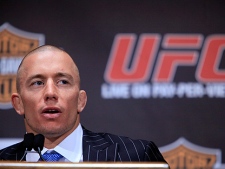 Georges St. Pierre speaks to reporters during a news conference at Radio City Music Hall, Wednesday, March 24, 2010 in New York. St. Pierre and Dan Hardy are scheduled to meet Saturday in Newark, N.J., in UFC 111 for St. Pierre's mixed martial arts title. (AP Photo/Mary Altaffer)