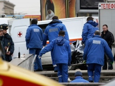 Emergency Ministry workers carry a body to a vehicle in downtown Moscow on Monday, March 29, 2010. Two female suicide bombers blew themselves up on Moscow's subway system as it was jam-packed with rush-hour passengers Monday, killing at least 37 people and wounding 102.(AP Photo)
