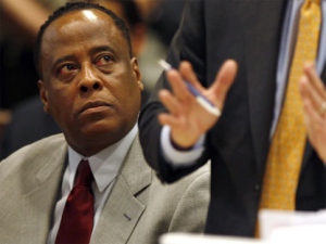 Conrad Murray, Michael Jackson's doctor, left, looks on as his attorney Ed Chernoff speaks during his arraignment at the Los Angeles Superior Court on charges of involuntary manslaughter in the singer's death in Los Angeles on Monday, Feb. 8, 2010. (AP / Mark Boster)