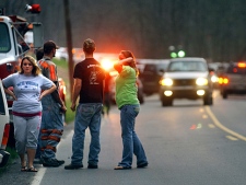 Families and friends wait alongside emergency personnel after a mine explosion occured at the Upper Big Branch Mine, in Montcoal, W.Va., on Monday April 5, 2010. (AP Photo/Jon C. Hancock) 