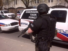 Members of the Emergency Task Force respond to a shooting near Vaughan Road Academy. (CP24/Tristan Phillips)