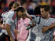 Toronto FC's Dwayne De Rosario (left) is congratulated by Sam Cronin after scoring against Montreal Impact during first half action in the Nutrilite Canadian Championship in Toronto, on Wednesday April 28, 2010. (THE CANADIAN PRESS/Chris Young)