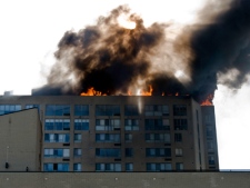 A fire rages on the roof of a Queen's Quay condo building on Thursday, April 29, 2010. <br><br>