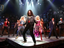 In this theatre publicity image released by Barlow Hartman Public Relations, Constantine Maroulis, centre, performs with the rest of the company in the musical, 'Rock of Ages,' in New York.