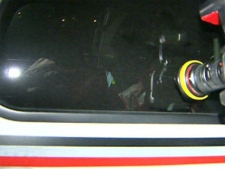 The unidentified driver covers his face as he is transported in a TTC vehicle from Toronto police Traffic Services headquarters, Wednesday night, May 13, 2010.