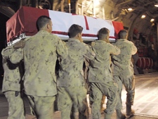 Canadian solders carry the casket of Pte. Kevin McKay of the Edmonton-based 1st Battalion, Princess Patricia's Canadian Light Infantry (PPCLI) at Kandahar Airfield, Afghanistan, on Friday May 14, 2010. (Tara Brautigam / THE CANADIAN PRESS)