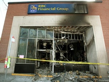 Damage is seen Wednesday, May 19, 2010 that was caused by a firebomb at an Ottawa downtown bank early Tuesday morning. Anarchists who claimed to have firebombed the bank are vowing to take their protest to the upcoming G8 and G20 summits in Ontario. (THE CANADIAN  PRESS/Fred Chartrand)