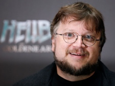 In this Aug. 19, 2008 file photo, Mexican director Guillermo del Toro poses for the media during a photo call to promote the movie "Hellboy 2-The Golden Army" in Berlin. (AP Photo/Miguel Villagran, File)