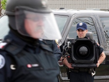 A police officer stands behind the Public Order Unit with a LRAD-X 100 Acoustic Communication Device (sound cannon) during a demonstration of G20 security and crowd control measures in Toronto on Thursday June 3, 2010. Police on bicycles, horseback and in riot gear will be at the ready in Toronto during the G20 summits � and those will just be the ones you can see.The Integrated Security Unit gave a demonstration of the massive security operation Thursday. (THE CANADIAN PRESS/Frank Gunn)