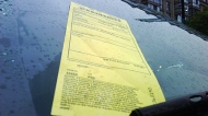 A parking ticket is affixed to the windshield of a vehicle on Wednesday June 9, 2010. (CP24/Mathew Reid)
