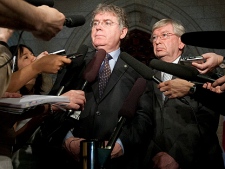 NDP MP Jack Harris(left) and Joe Comartin comment on the Afghan detainee document negotiations in the foyer of the House of Commons on Parliament Hill in Ottawa, Tuesday June 15, 2010. (THE CANADIAN  PRESS/Adrian Wyld)