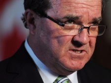 Finance Minister Jim Flaherty holds a press conference in the foyer of the House of Commons on Parliament Hill in Ottawa on Monday, May 14, 2012. (THE CANADIAN PRESS/Sean Kilpatrick)