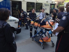 Eight people were injured when a TTC bus came to an abrupt stop in Bay Street's southbound lanes, near Wellesley Street, on Thursday, May 17, 2012. (CP24/Katie Simpson)