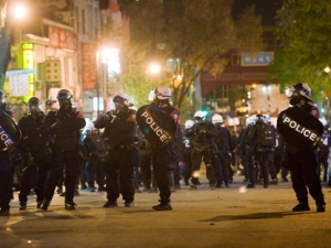 Police move in on protesters during a large protest designed as an act of defiance against a legal crackdown by the Quebec government, in Montreal on Friday, May 18, 2012. (THE CANADIAN PRESS/Graham Hughes)