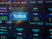 The Facebook logo appears on a display inside the NASDAQ Marketsite in Times Square Thursday, May 17, 2012, in New York. Facebook priced its IPO at $38 per share on Thursday, at the high end of its expected range. (AP Photo/Frank Franklin II)