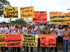 Filipino Christian youths chant "Stop the Lady Gaga concerts" during a rally outside the Pasay City Hall in Pasay, south of Manila, Philippines, on Friday, May 18, 2012, calling for the cancellation of the singer's May 21-22 concerts. The youths said they are offended by Lady Gaga's music and videos, in particular her song "Judas," which they say mocks Jesus Christ. (AP Photo/Bullit Marquez)