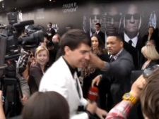 In this video image taken from AP video U.S. actor Will Smith, center right, slaps reporter Vitalii Sediuk, white suit, from the Ukrainian television channel 1+1 on the red carpet before the premiere of "Men in Black III" Friday May 18, 2012 in Moscow. Hollywood star Will Smith has slapped a male television reporter who tried to kiss him before the Moscow premiere of "Men in Black III." Smith pushed him away and then slapped him lightly across the cheek with the back of his left hand. (AP Photo via AP video)