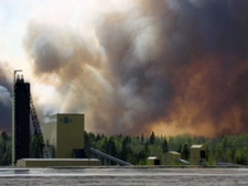 This image taken from video shows smoke over a forest in Kirkland Lake, Ont., on Monday, May 21, 2012. (CTV/Jean Szalejko) 