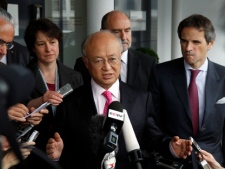 Yukiya Amano, director general of the International Atomic Energy Agency, speaks to the media after returning from Iran at Vienna International Airport, near Schwechat, Austria, on Tuesday, May 22, 2012. Amano says he has reached a deal with Iran on probing suspected work on nuclear weapons and adds that the agreement will "be signed quite soon." (AP Photo/Ronald Zak)