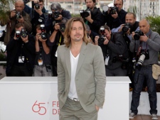 Actor Brad Pitt poses during a photo call for "Killing Them Softly" at the 65th international film festival in Cannes, France, Tuesday, May 22, 2012. (AP Photo/Lionel Cironneau)