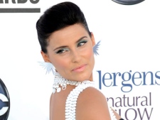 In this photo provided by the Las Vegas News Bureau, Canadian singer-songwriter Nelly Furtado walks the red for the 2012 Billboard Music Awards at the MGM Grand on the Las Vegas Strip on Sunday, May 20, 2012. (AP Photo/Las Vegas News Bureau, Glenn Pinkerton)