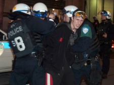 Police arrest a protester during a demonstration against tuition fee hikes in Montreal on Tuesday, May 22, 2012. (THE CANADIAN PRESS/Ryan Remiorz)