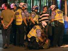 Police arrest protesters after a march against tuition fee hikes early Thursday, May 24, 2012, in Montreal. (THE CANADIAN PRESS/Ryan Remiorz)
