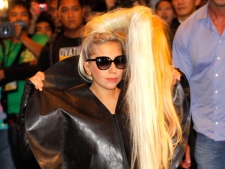 In this May 19, 2012 file photo, American pop singer Lady Gaga poses before the media upon her arrival in a hotel in Manila's financial district of Makati, Philippines. (AP Photo/Pat Roque, File)