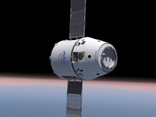 This computer generated image provided by SpaceX shows their Dragon spacecraft with solar panels deployed. The world's first private supply ship flew tantalizingly close to the International Space Station on Thursday, May 24, 2012, but did not stop, completing a critical test in advance of the actual docking scheduled for Friday, May 25, 2012. (AP Photo/SpaceX)