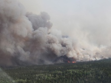 A forest fire burns near Timmins, Ont., on Thursday, May 24, 2012. (THE CANADIAN PRESS/Ontario Ministry of Natural Resources-Christine Rosche)