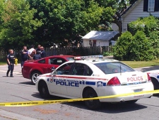 Police are seen placing a man under arrest in south Oshawa on May 30, 2012. (Adrian Spiering/MyBreakingNews)