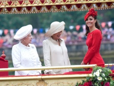 Britain's Kate, Duchess of Cambridge, left, Camilla, Duchess of Cornwall, centre, and Queen Elizabeth, look at the proceedings on the royal barge, the principal boat of a flotilla of 1,000 vessels, during a river pageant to celebrate the Queen's Diamond Jubilee in London, Sunday, June 3, 2012. An armada of vessels, from historic sailboats and barges to kayaks, lifeboats and military launches, took part in Sunday's river pageant to mark the queen's 60 years on the throne. (AP Photo/David Crump, Pool) 
