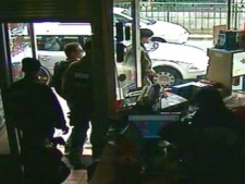 This image taken from CCTV obtained by Associated Press video shows Luka Rocco Magnotta, 2nd left, being removed by police from the Internet cafe in the district of Neukoelln in Berlin, Germany, on Monday, June 4, 2012. (AP Photo/AP Video) 