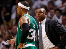 Boston Celtics head coach Doc Rivers speaks to Paul Pierce (34) during the first half of Game 5 in their NBA basketball Eastern Conference finals playoffs series against the Miami Heat on Tuesday, June 5, 2012, in Miami. (AP Photo/Lynne Sladky)