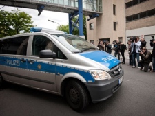 A police car arrives at the Moabit jail in Berlin supposed to carry Luka Rocco Magnotta who is to be brought before a judge in Berlin, Germany, on Tuesday, June 5, 2012. (AP Photo/dapd/ Paul Zinken)