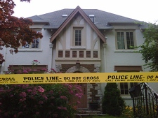Police tape surrounds the home of a man charged in connection with a G20 investigation. (CP24/Mathew Reid)