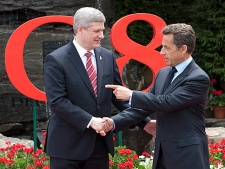 Canadian  Prime Minister Stephen Harper welcomes French President Nicolas Sarkozy to the G8 Summit in Huntsville, Ont., on Friday June 25, 2010. (THE CANADIAN PRESS/Adrian Wyld)