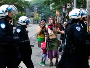 Activists and protesters heckle riot police while marching along the streets of downtown Toronto during the G20 Summit on Saturday, June 26, 2010. (Nathan Denette/THE CANADIAN PRESS)