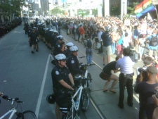 Officers move protesters away from Toronto Police headquarters during an afternoon protest against police tactics during the G20 on Monday, June 28, 2010. 