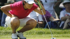 Yani Tseng, of Taiwan, lines up a putt on the ninth hole during the Wegmans LPGA Championship.