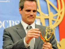 Michael Park, a cast member in "As the World Turns," looks at his Daytime Emmy for Outstanding Lead Actor in a Drama Series backstage at the Annual Daytime Emmy Awards in Las Vegas, Sunday, June 27, 2010. (AP Photo/Chris Pizzello)