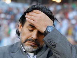Argentina's head coach Diego Maradona holds his head prior to the World Cup quarterfinal soccer match between Argentina and Germany in the Green Point Stadium in Cape Town, South Africa, Saturday, July 3, 2010. (Peter Klaunzer/AP Photo/Keystone) 